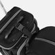Close-up of a black suitcase with a handle and strap on a white background